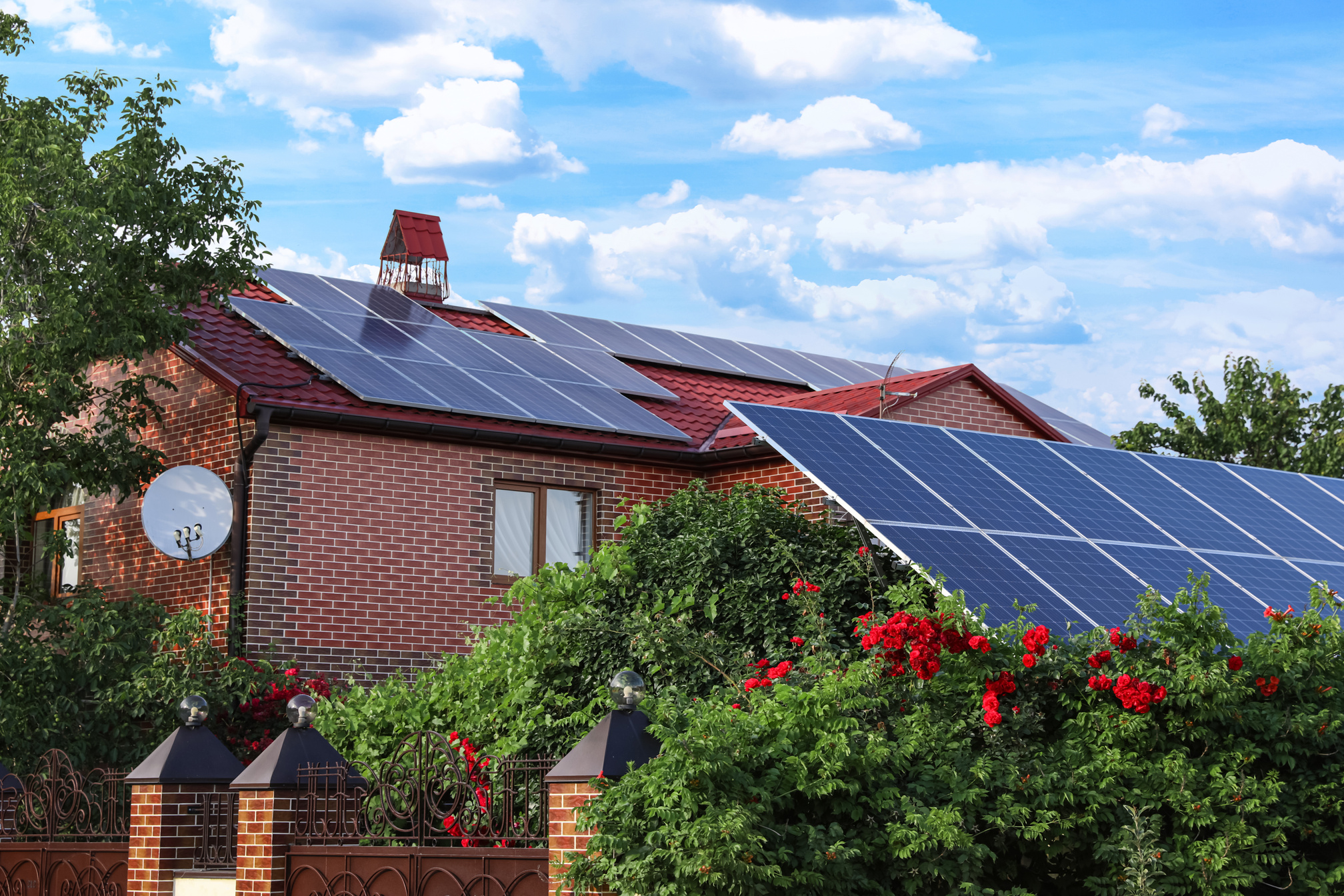 House with Installed Solar Panels on Roof. Alternative Energy so